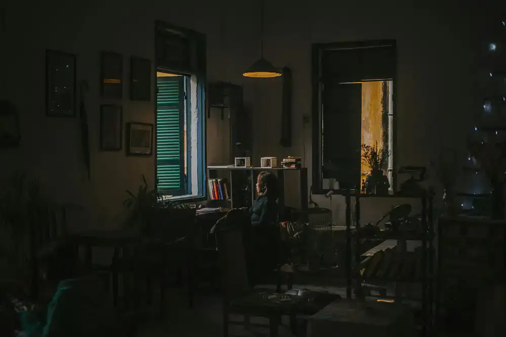A cozy reading corner by a large bookshelf