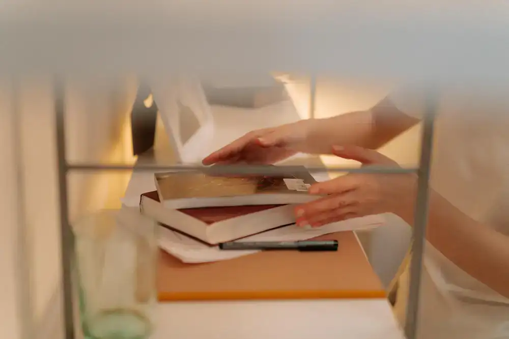 Cosy shelf photography with someone reading a book